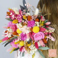 Vibrant pink, yellow, and fuchsia dried flower bouquet, perfect for a summer wedding.
