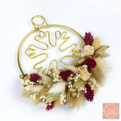 Winter-inspired dried flower decoration with gold wire snowflake