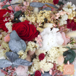 Close-up of preserved red roses and eucalyptus in the Éclat Passion bouquet.