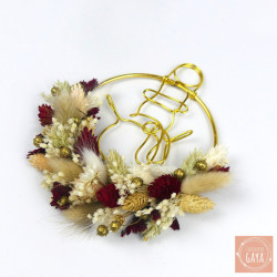 Winter-themed dried flower decoration with gold wire snowman